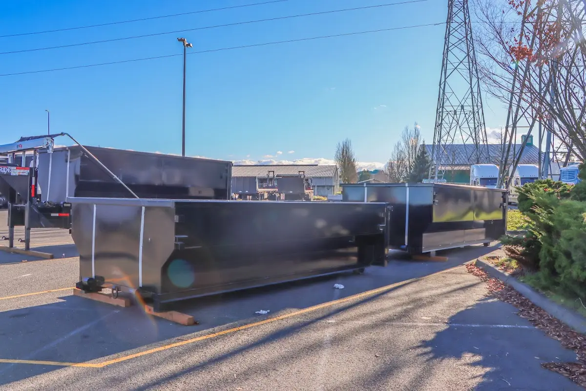 Roll-off dumpster ready for waste disposal at job site for Yard Waste Dumpster Rental in Denison